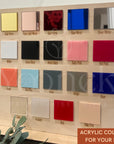 Acrylic color swatch board with various colors on a wooden frame