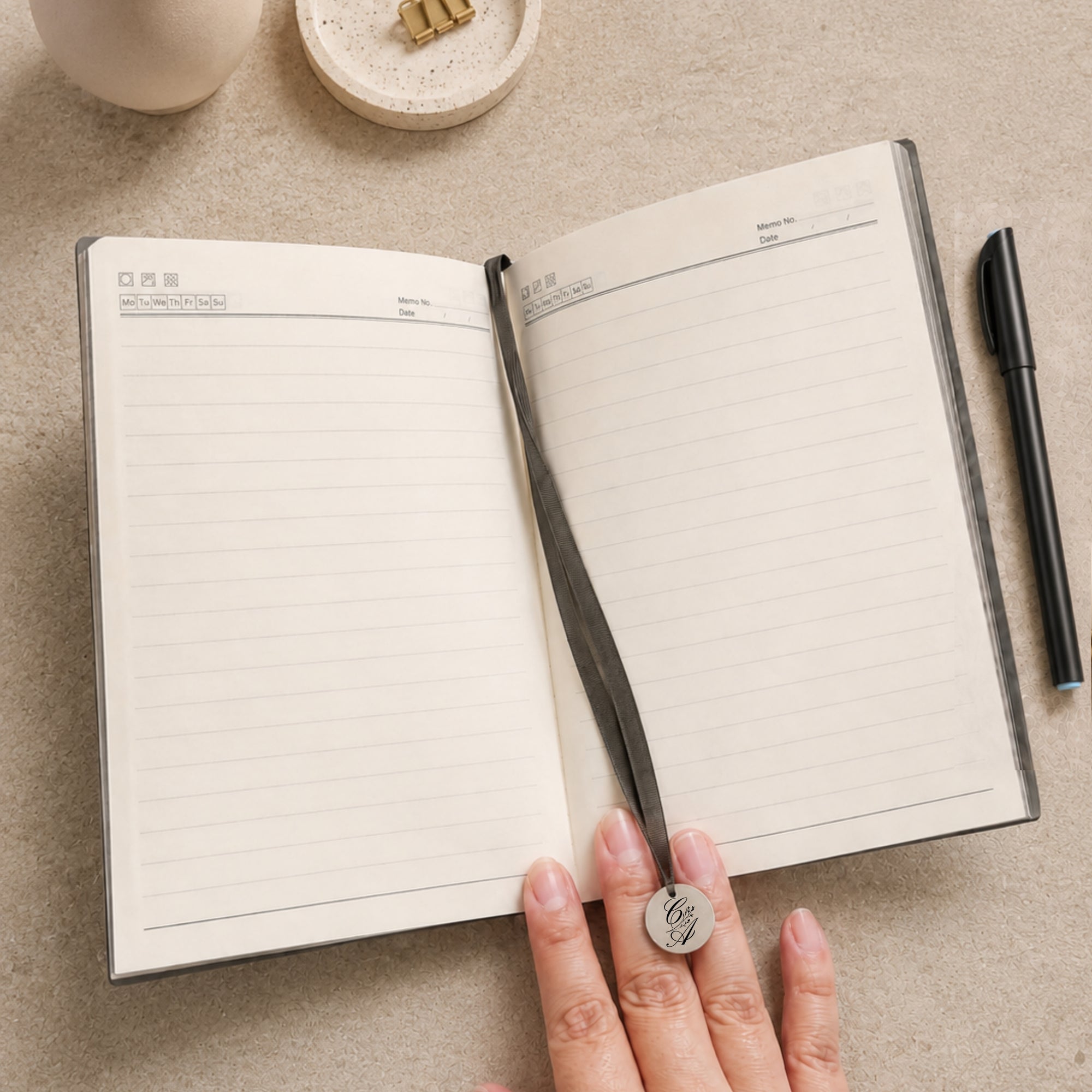 A5 journal notebook lined pages with pen in loop