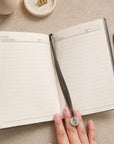 A5 journal notebook lined pages with pen in loop