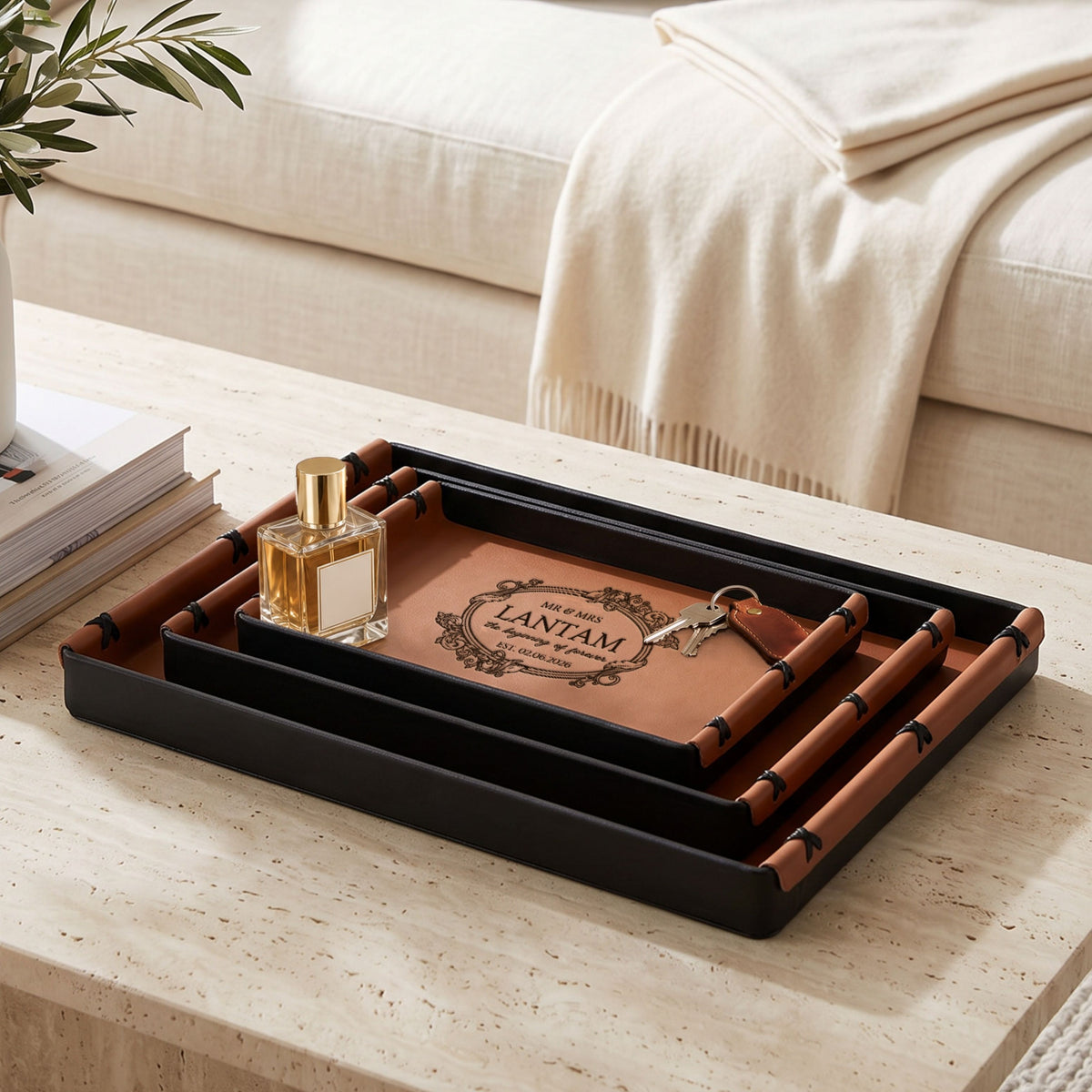 Set of three brown leatherette trays in three sizes on a coffee table
