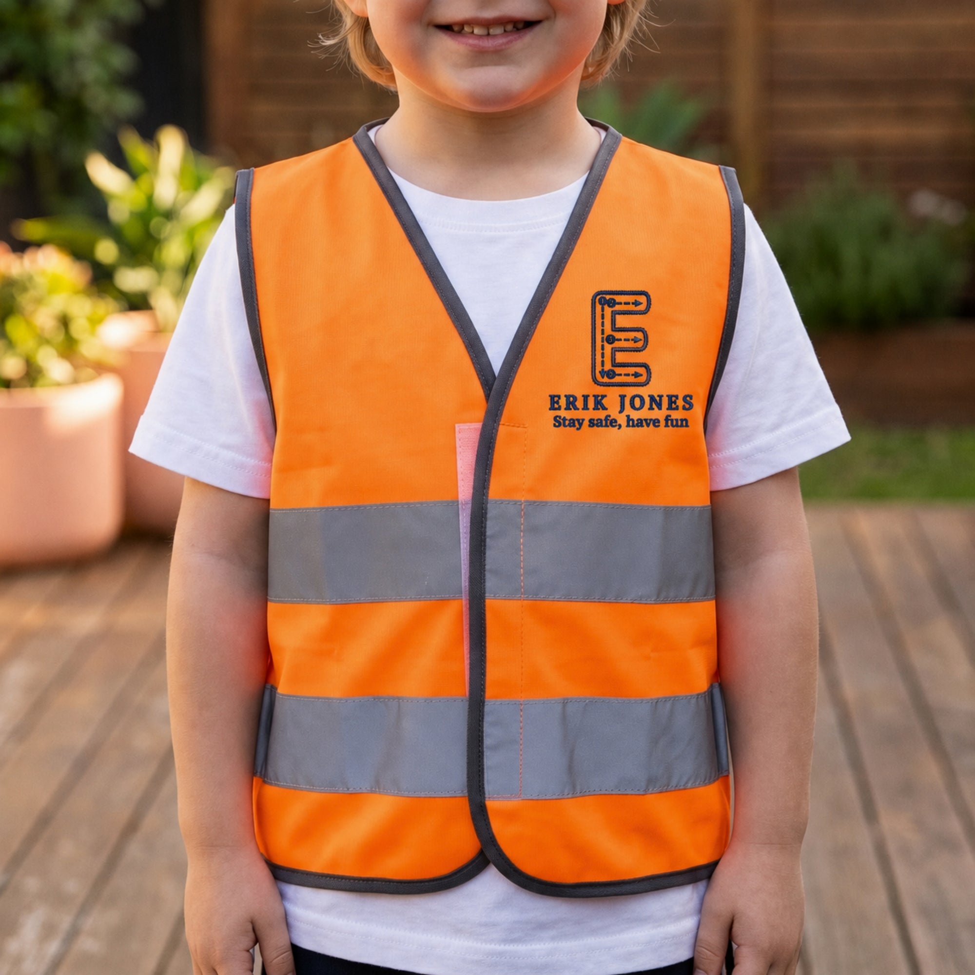 Custom embroidered kids hi-vis safety vest in fluoro yellow orange and pink