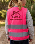 Close-up of embroidered name on back of kids hi-vis safety vest