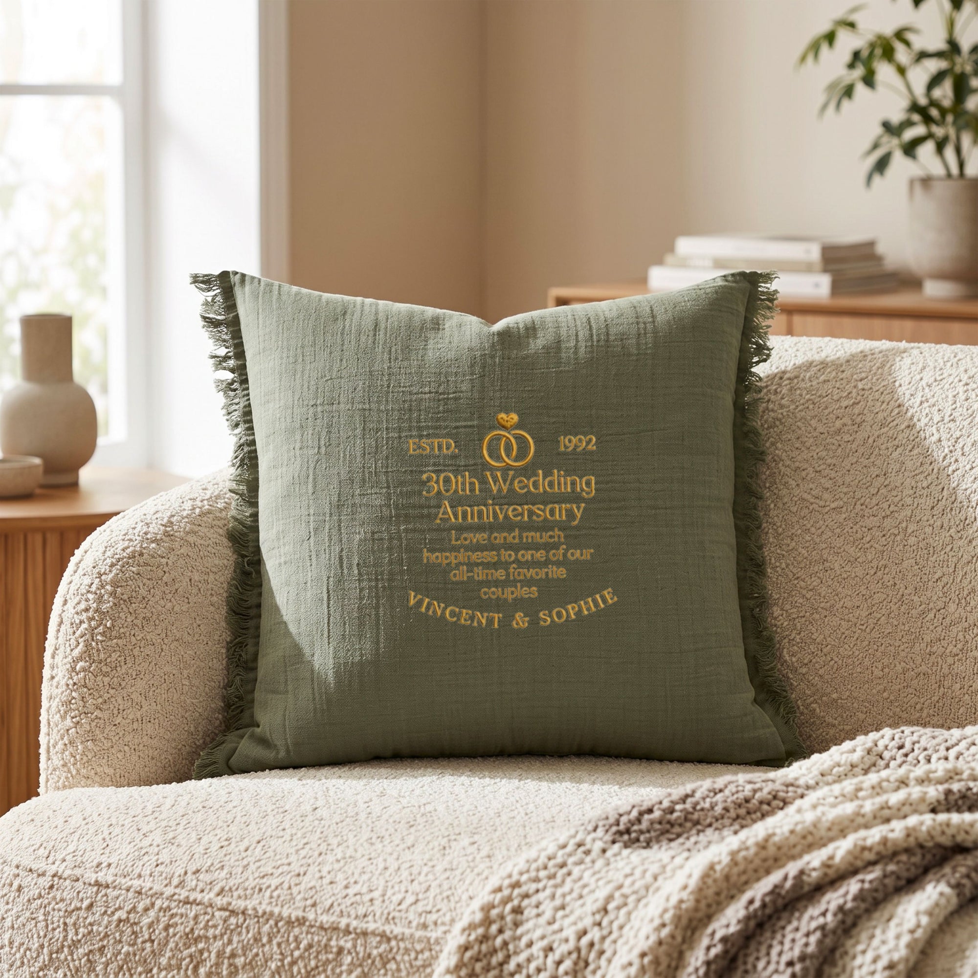 Close-up of embroidered name on personalised cotton muslin cushion cover