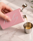 Close-up of laser engraved name and date on personalised 5oz stainless steel hip flask