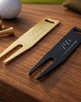 Close-up of engraved name and date on personalised golf divot repair tool
