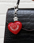 Close-up of engraved name on personalised heart mini hip flask keyring