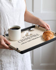Personalised beige leatherette serving tray with coffee and a croissant, engraved with a name