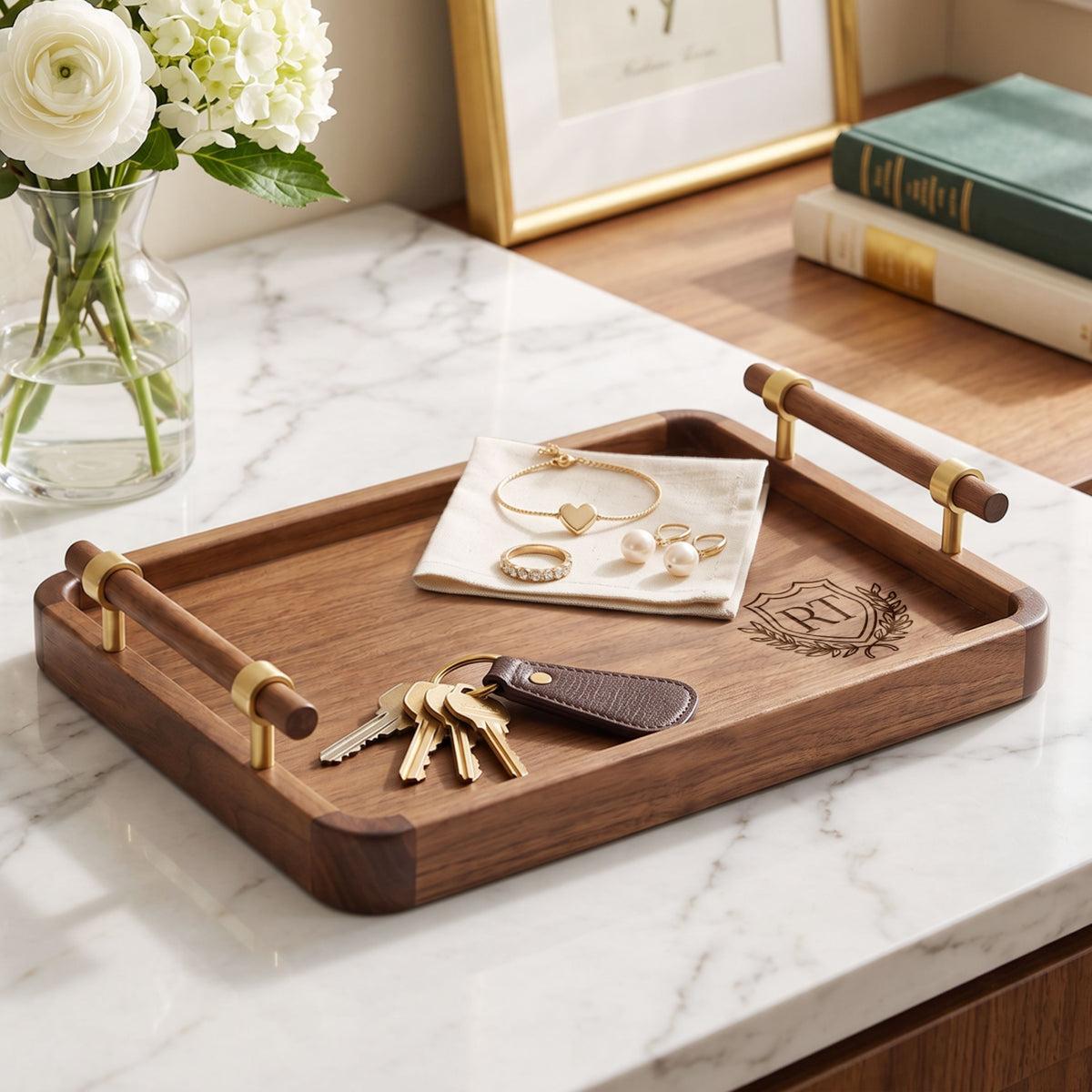 Personalised black walnut valet tray holding keys and jewellery on a vanity