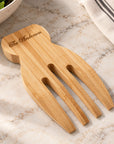 Personalised bamboo salad hands close up engraving detail