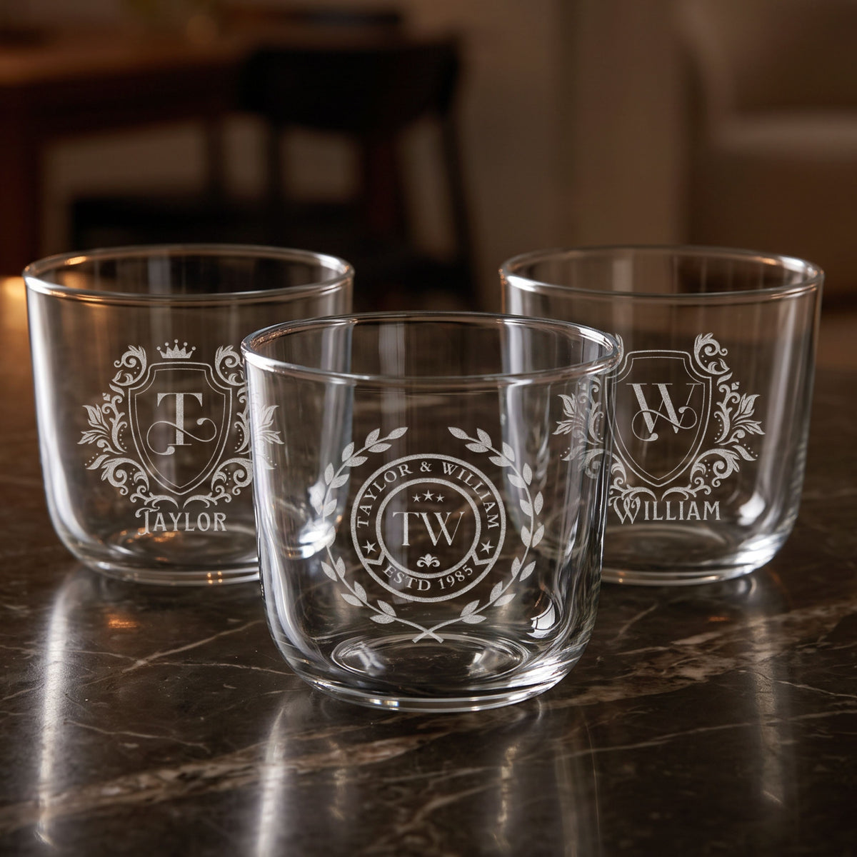 Three personalised engraved beverage glass tumblers with monogram designs