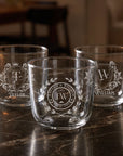 Three personalised engraved beverage glass tumblers with monogram designs