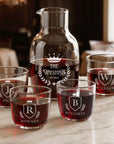 Personalised engraved glass carafe with four glasses and red wine, family monograms