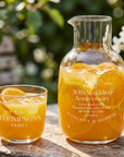 Personalised engraved glass carafe and glass set with juice, engraved anniversary design