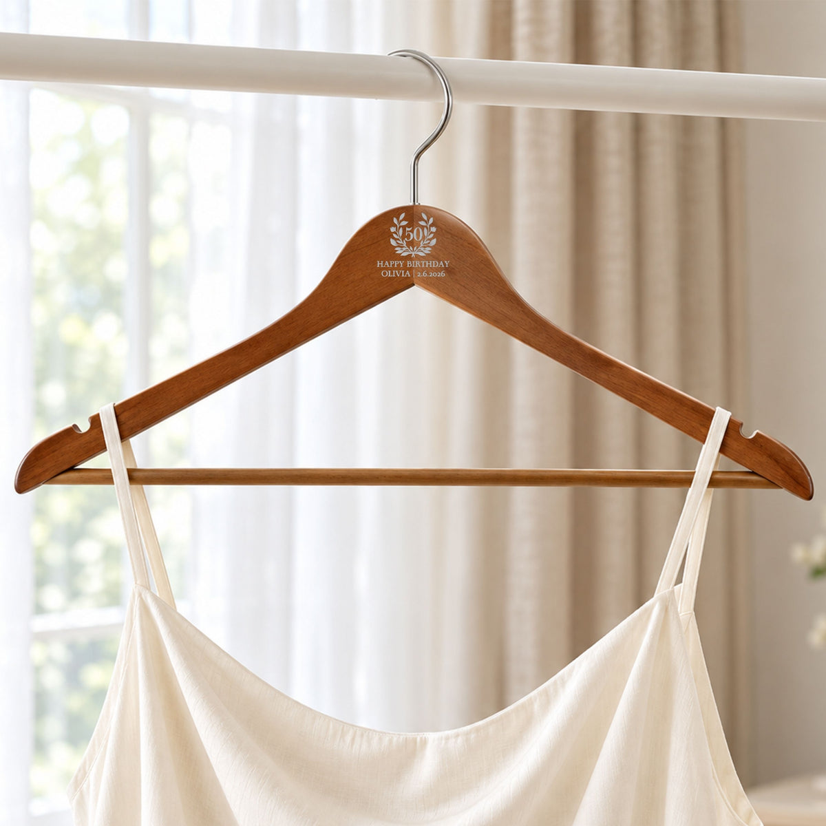 Custom engraved walnut coat hanger with trouser bar