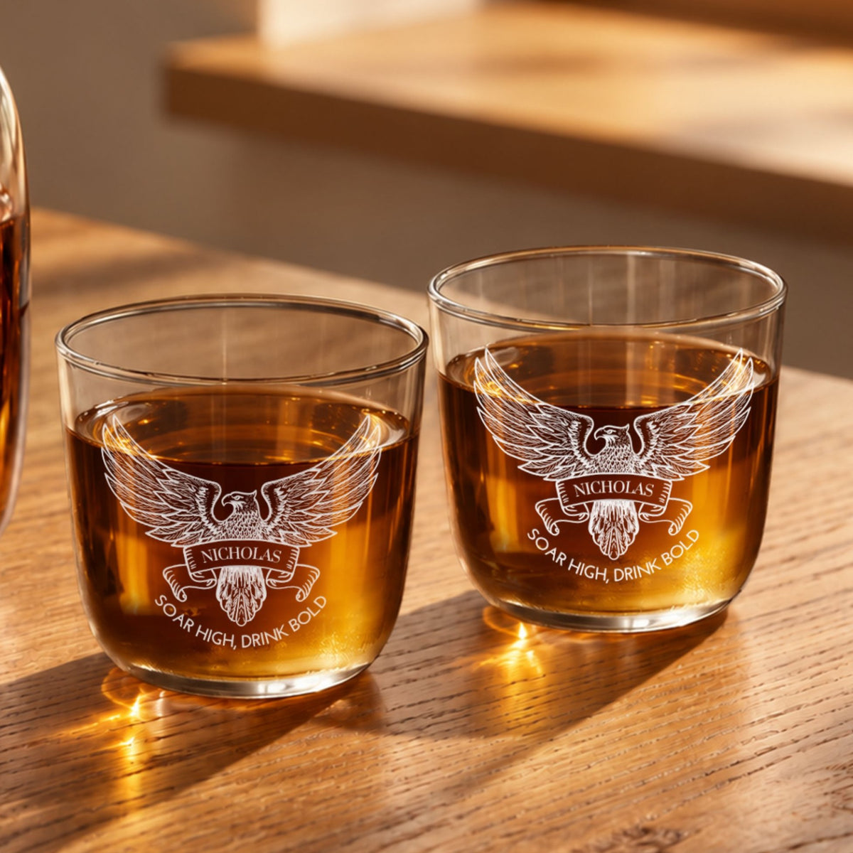 Two personalised engraved glass tumblers with whisky and an eagle design