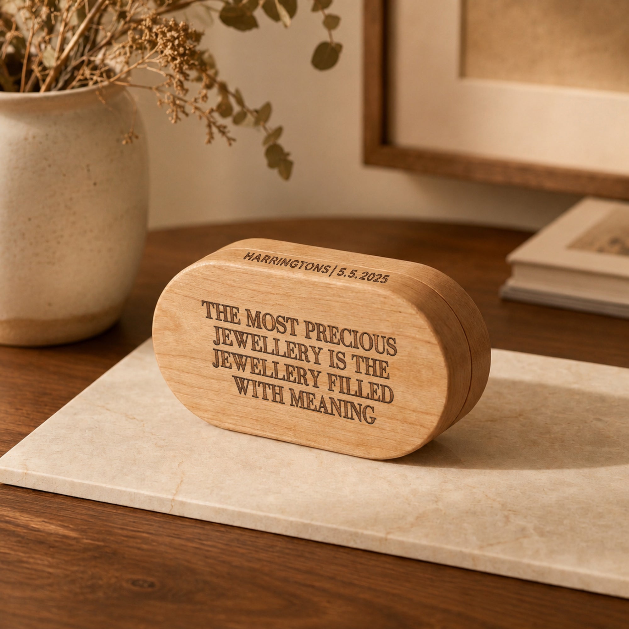 Personalised engraved oval wooden jewellery box holding rings and a necklace