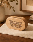 Personalised engraved oval wooden jewellery box holding rings and a necklace