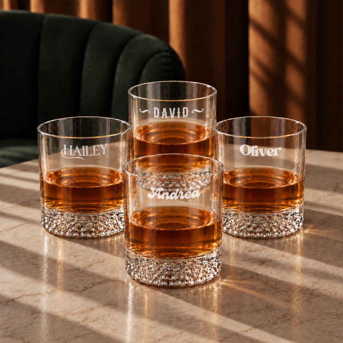 Four personalised patterned-bottom whisky glasses engraved with names