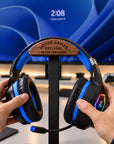 Walnut and metal headphone stand with gaming headset, head engraved with a name and date
