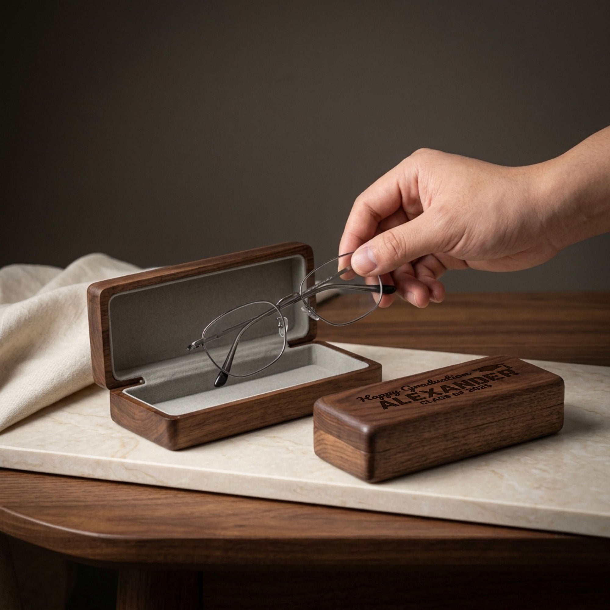 Personalised engraved walnut wood glasses case being opened – custom eyewear gift