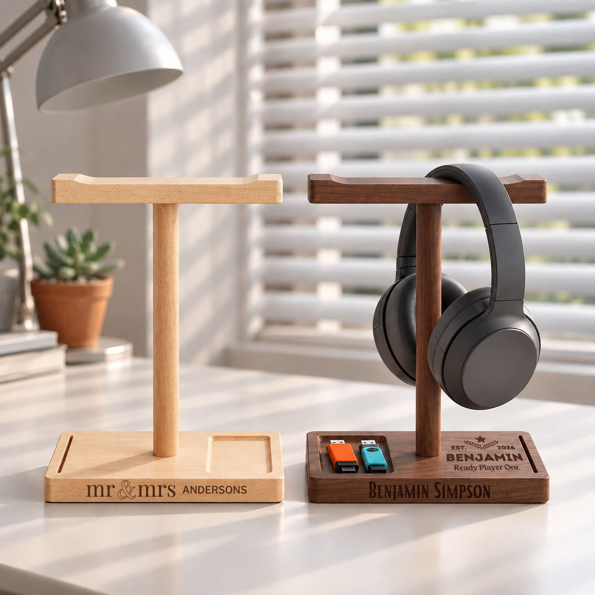 Personalised wooden headphone stands in beech and walnut with storage trays, engraved with names