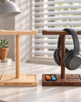 Personalised wooden headphone stands in beech and walnut with storage trays, engraved with names