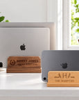 Personalised wooden laptop and tablet stands in beech and walnut holding a laptop and tablet