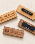 Wooden name badges showing brooch pin and magnetic back fittings