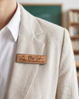 Personalised rectangle wooden name badge worn on a blazer, engraved with a name and role